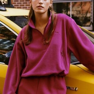 TNA aritzia
SNO POLAR ½ ZIP SWEATER. Color: bold fuchsia